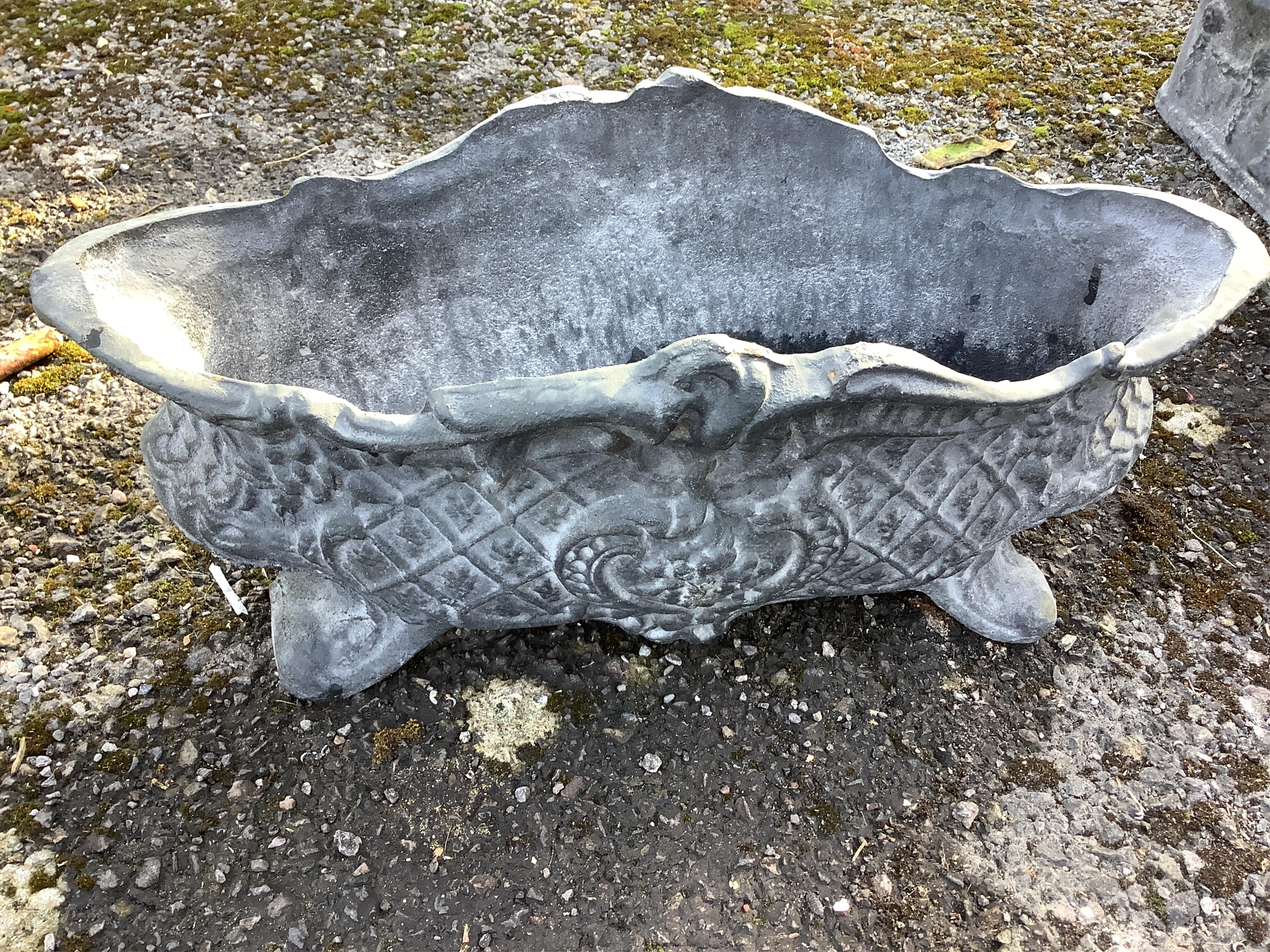 A set of four cast iron planters, width 36cm, and a pair of more ornate planters, width 48cm. Condition - weathered, otherwise good